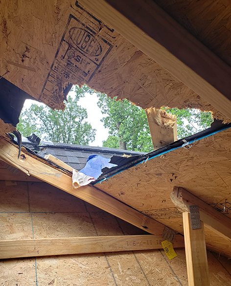 Damaged roof with a hole