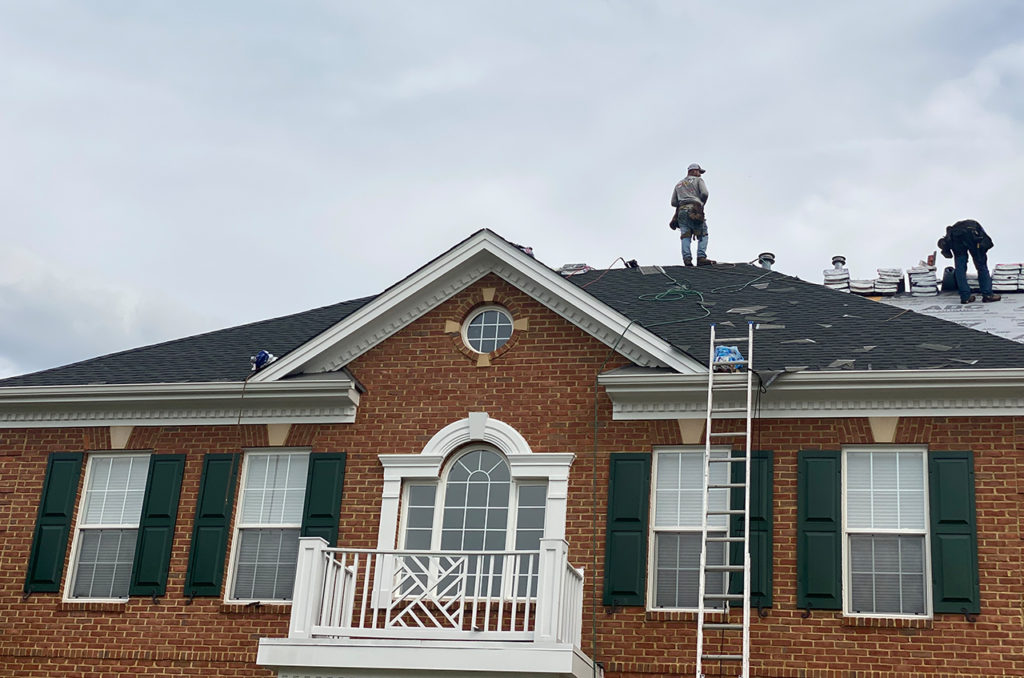 Fab build pro roofing contractor working on top of roof