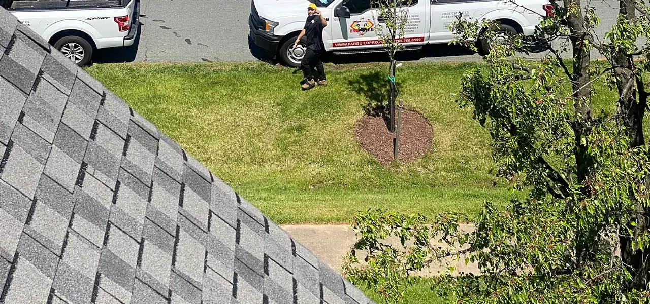 fab build pro roofing team waving at camera